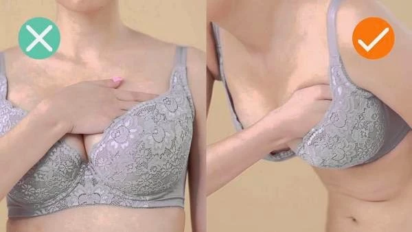 Move your breasts into the cups of the bra